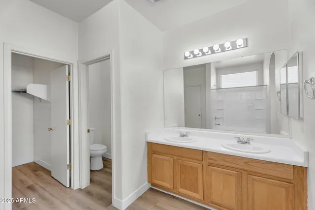 a picture of a bathroom with mirror