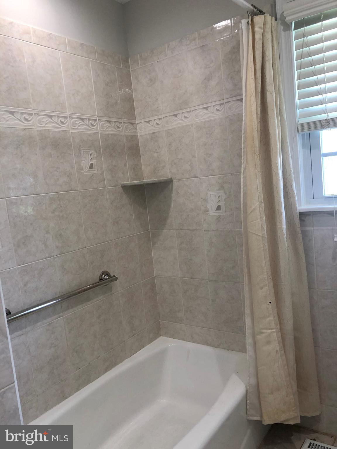 404 Flanders Road Bellmawr, NJ 08031 - Photo 14 of 19 a bath tub sitting next to a shower