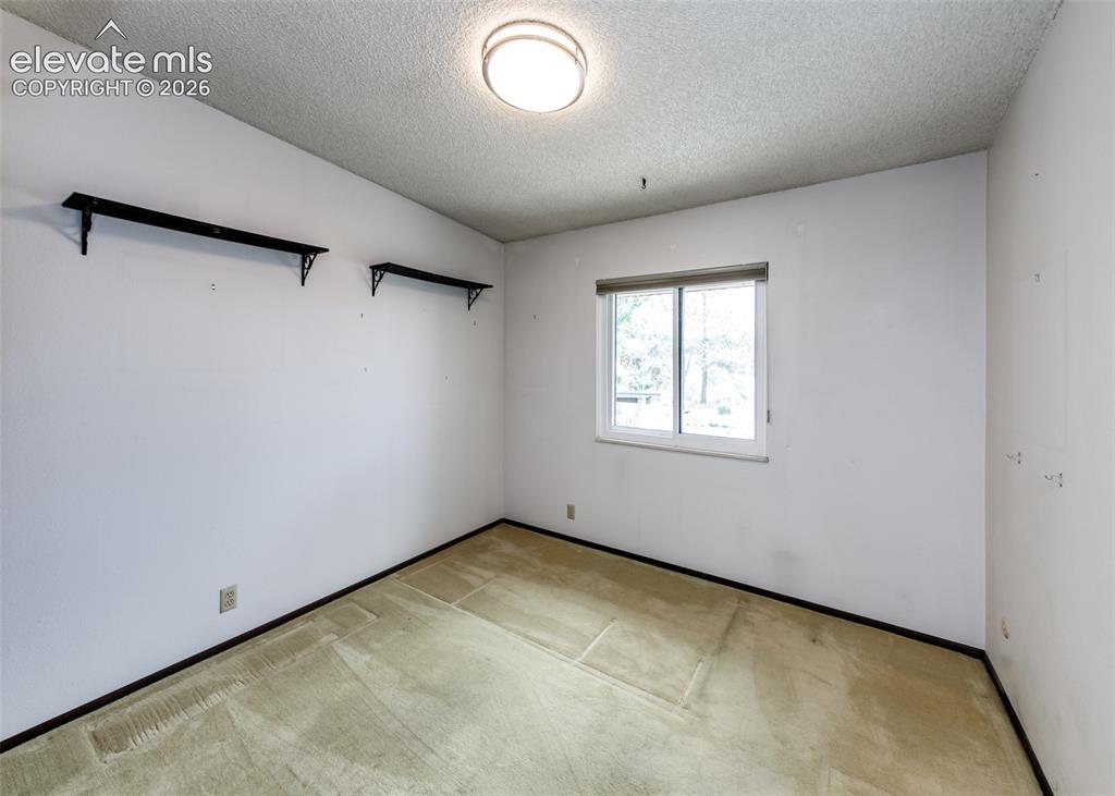 1034 Fontmore Road, Unit D Colorado Springs, CO 80904 - Photo 23 of 43 an empty room with a window