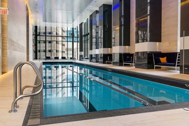 a view of a swimming pool with a balcony