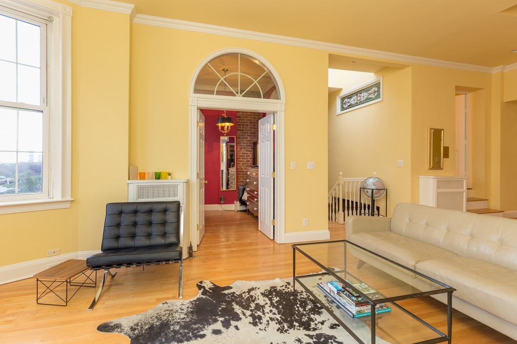 37 Bay State Road, Unit 6 Boston, MA 02215 - Photo 13 of 25 a living room with furniture and a window