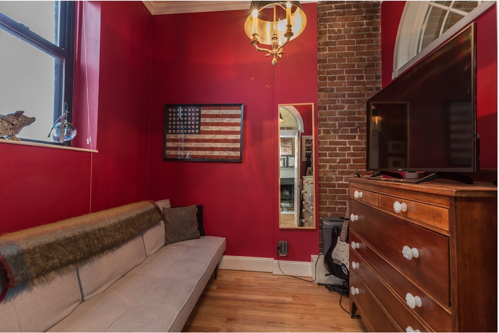 37 Bay State Road, Unit 6 Boston, MA 02215 - Photo 16 of 25 a view of a balcony with furniture and a flat screen tv