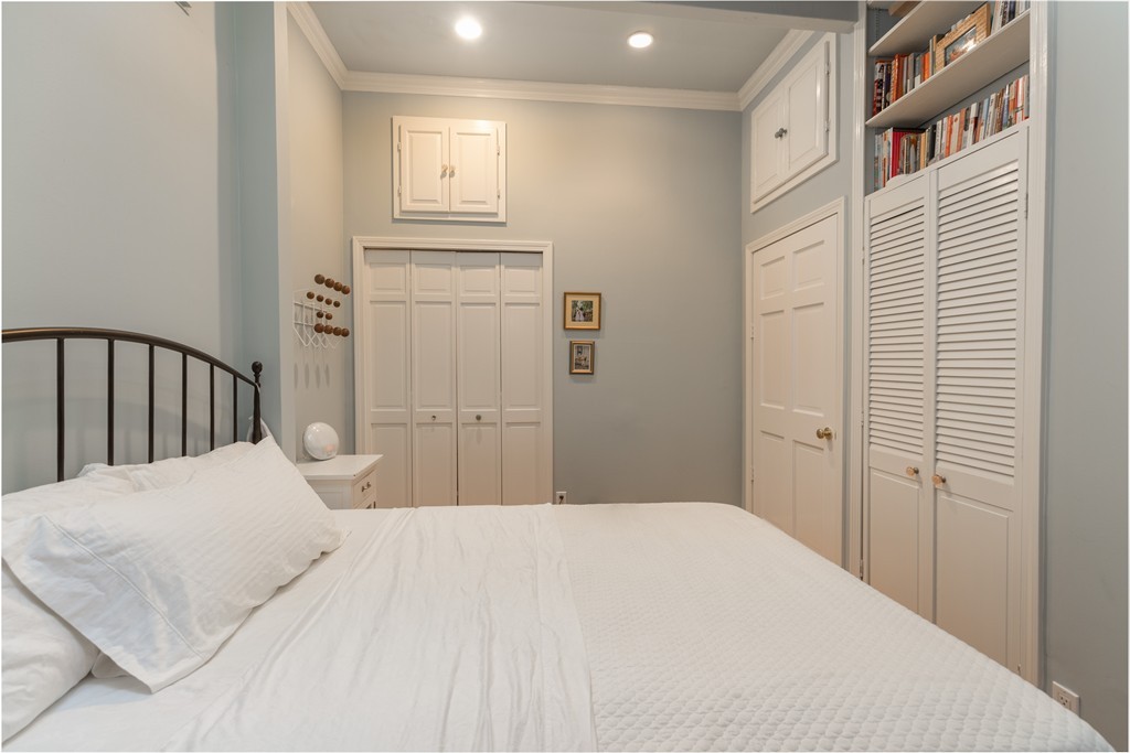37 Bay State Road, Unit 6 Boston, MA 02215 - Photo 18 of 25 a bedroom with a bed and a closet