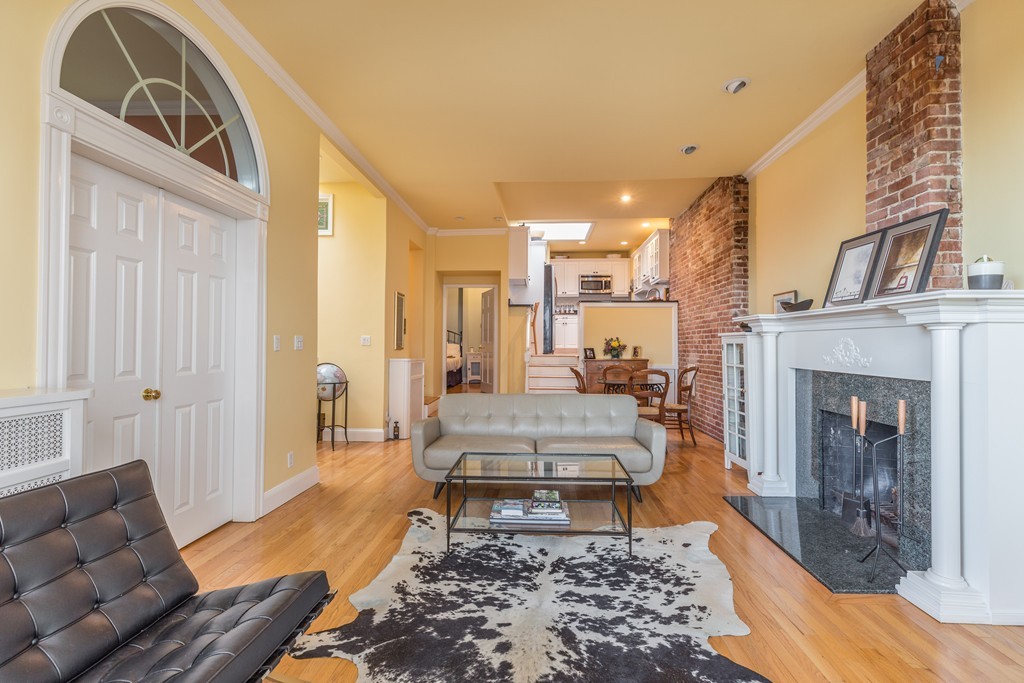 37 Bay State Road, Unit 6 Boston, MA 02215 - Photo 8 of 25 a living room with furniture and a fireplace