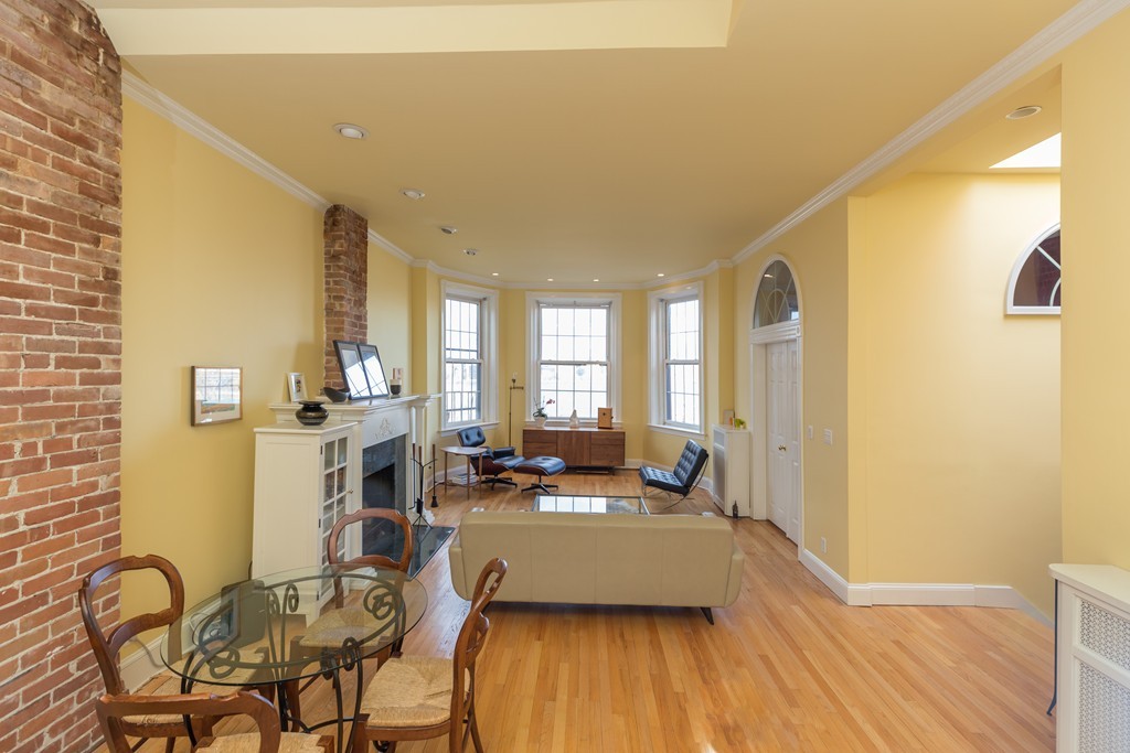 37 Bay State Road, Unit 6 Boston, MA 02215 - Photo 10 of 25 a living room with furniture and wooden floor