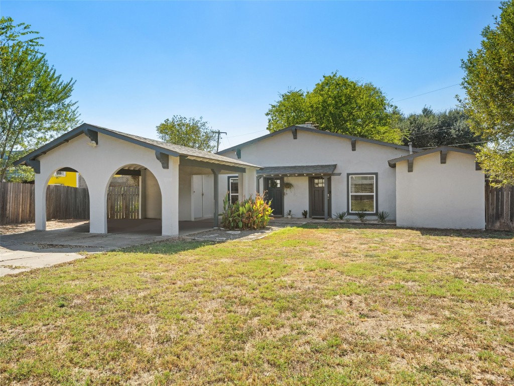 1307 East St Johns Avenue, Unit B Austin, TX 78752 - Photo 1 of 27 a house with trees in the background