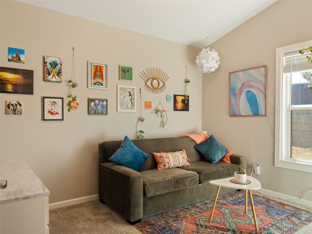 1307 East St Johns Avenue, Unit B Austin, TX 78752 - Photo 17 of 27 a living room with furniture and a window