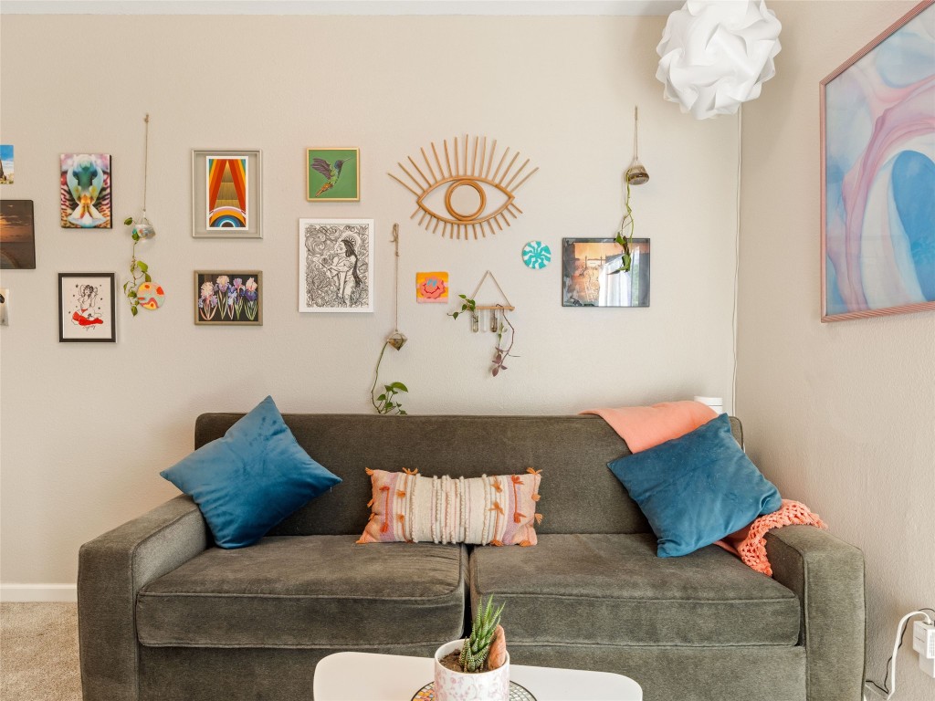 1307 East St Johns Avenue, Unit B Austin, TX 78752 - Photo 19 of 27 a bed room with a bed and a couch