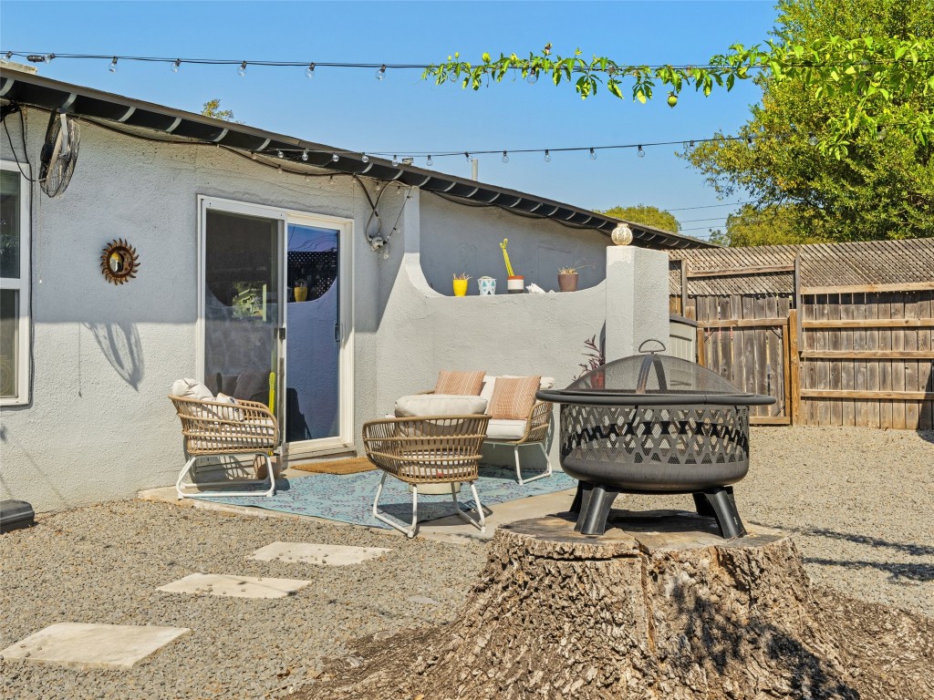 1307 East St Johns Avenue, Unit B Austin, TX 78752 - Photo 24 of 27 a view of a patio with a table and chairs