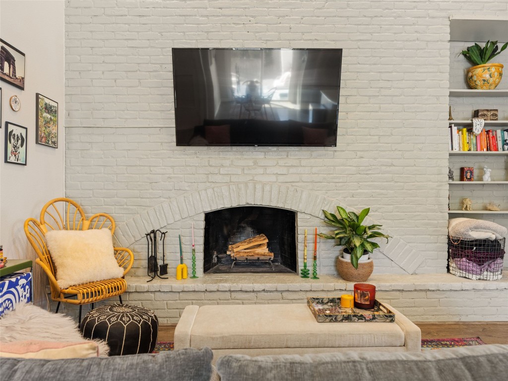 1307 East St Johns Avenue, Unit B Austin, TX 78752 - Photo 4 of 27 a living room with furniture fireplace and flat screen tv