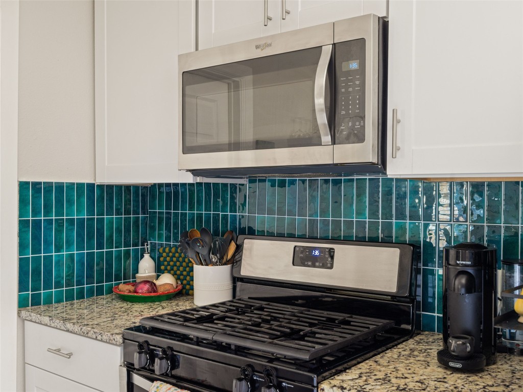 1307 East St Johns Avenue, Unit B Austin, TX 78752 - Photo 9 of 27 a stove top oven sitting inside of a kitchen