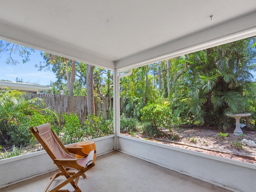 546-556 Azalea Lane Vero Beach, FL 32963 - Photo 12 of 18 a living room with a floor to ceiling window and outdoor view
