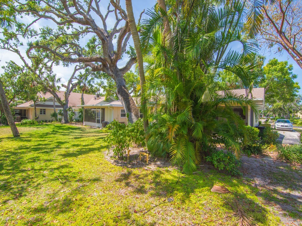 546-556 Azalea Lane Vero Beach, FL 32963 - Photo 17 of 18 a view of a house with a yard