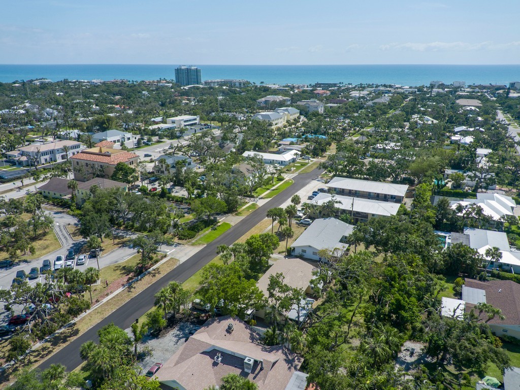 546-556 Azalea Lane Vero Beach, FL 32963 - Photo 18 of 18 an aerial view of city lake and trees
