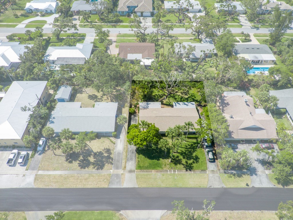 546-556 Azalea Lane Vero Beach, FL 32963 - Photo 2 of 18 an aerial view of residential houses with outdoor space