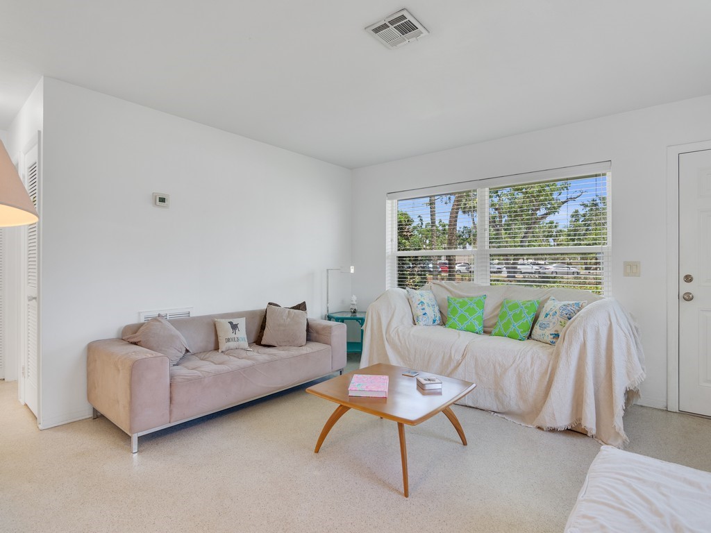 546-556 Azalea Lane Vero Beach, FL 32963 - Photo 4 of 18 a living room with furniture and a large window