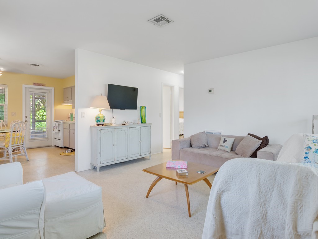 546-556 Azalea Lane Vero Beach, FL 32963 - Photo 6 of 18 a living room with furniture and a flat screen tv