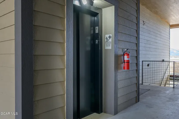 a view of a large building with a lot of lawn chairs