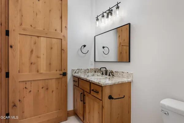 a bathroom with a sink and mirror
