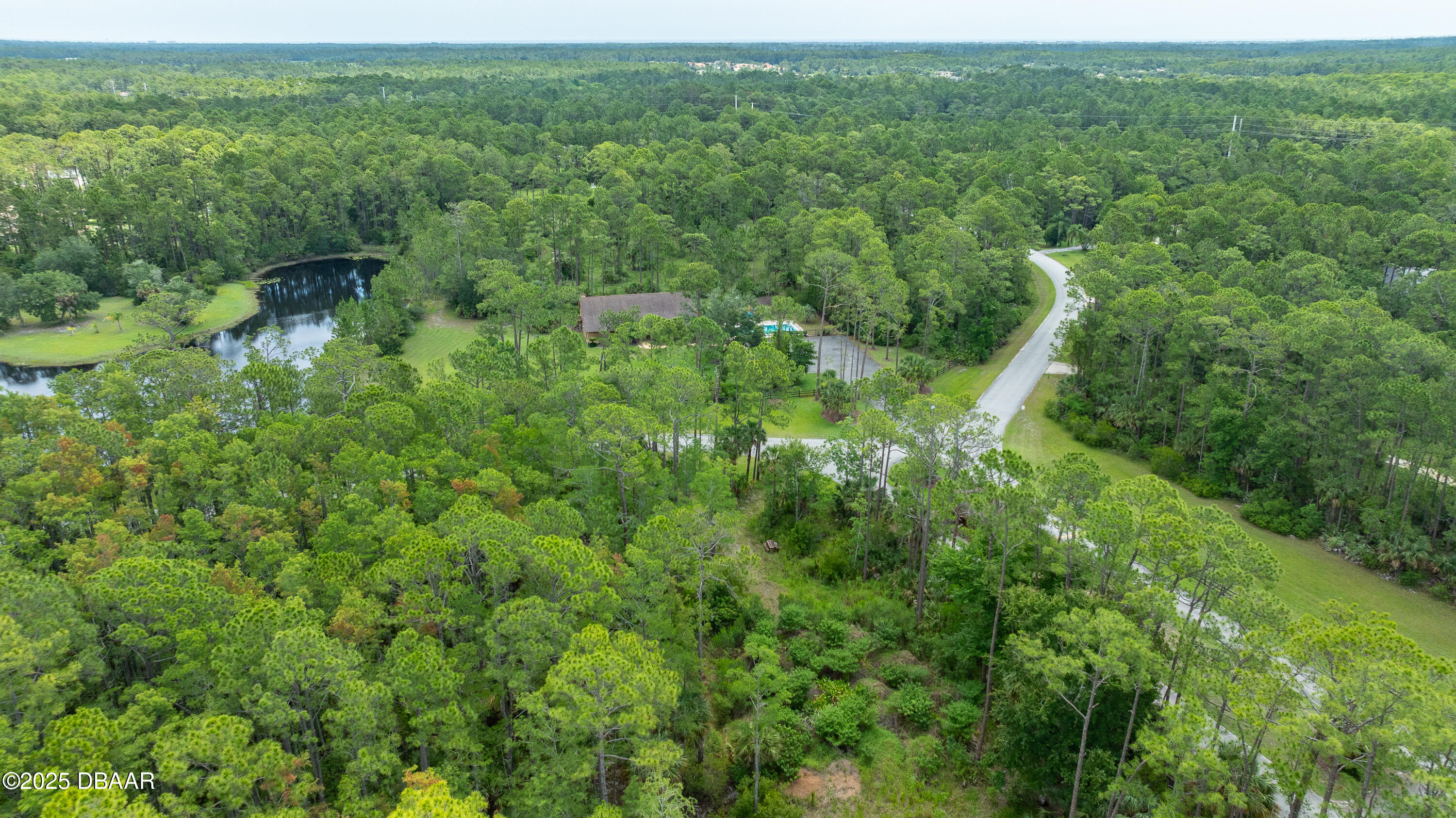3 Remington Road Ormond Beach, FL 32174 - Photo 17 of 18 a view of a green field with lots of trees