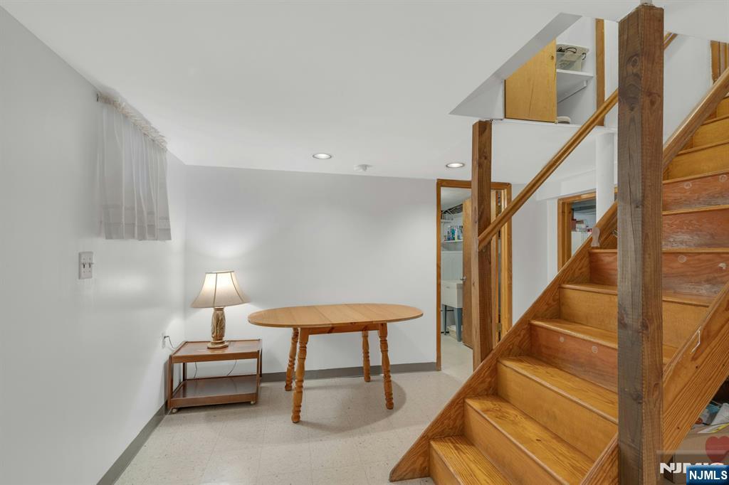 24 Cambridge Road Tenafly, NJ 07670 - Photo 25 of 31 a balcony with chairs and a potted plant on a table