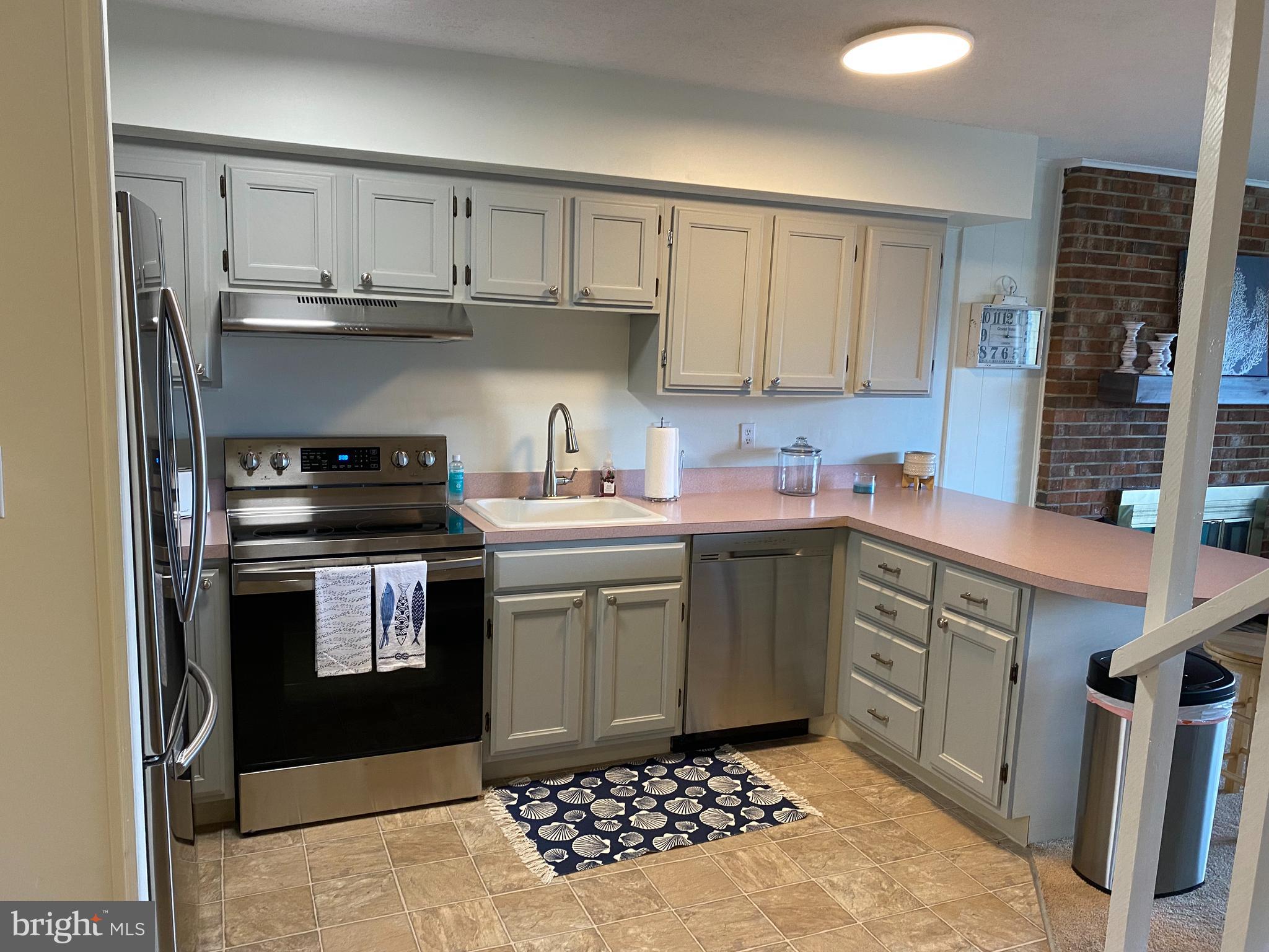 701 Rusty Anchor Road, Unit 15 Ocean City, MD 21842 - Photo 14 of 33 Kitchen - All new SS appliances