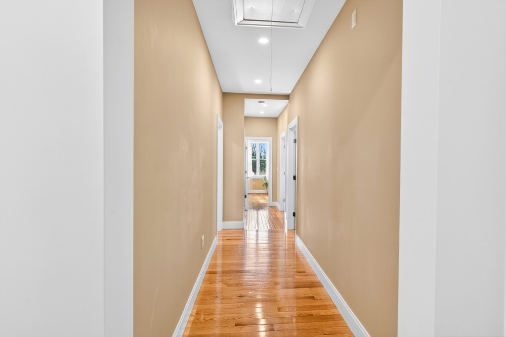 93 Alden Street Dedham, MA 02026 - Photo 20 of 41 a view of a hallway with wooden floor