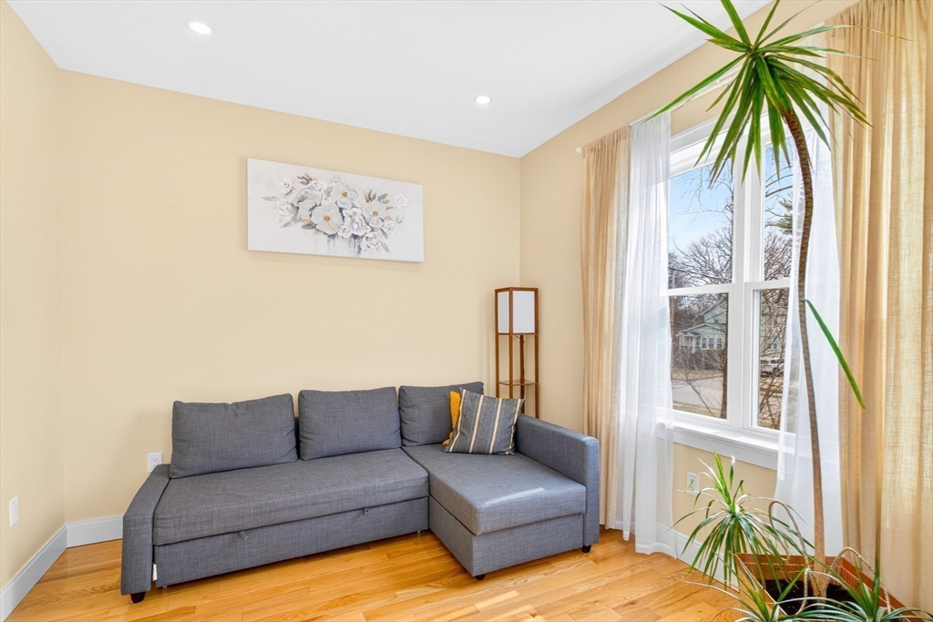 93 Alden Street Dedham, MA 02026 - Photo 23 of 41 a living room with furniture and a large window