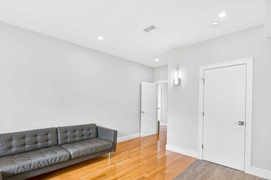 93 Alden Street Dedham, MA 02026 - Photo 30 of 41 a living room with furniture and a ceiling fan