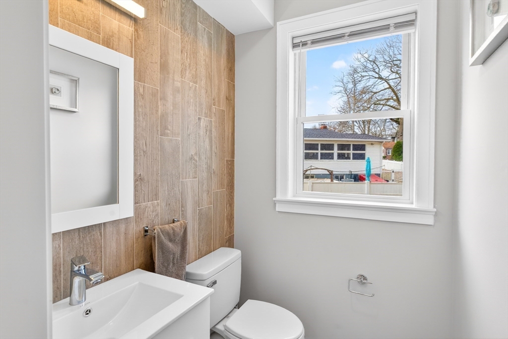 93 Alden Street Dedham, MA 02026 - Photo 31 of 41 a bathroom with a toilet and a sink