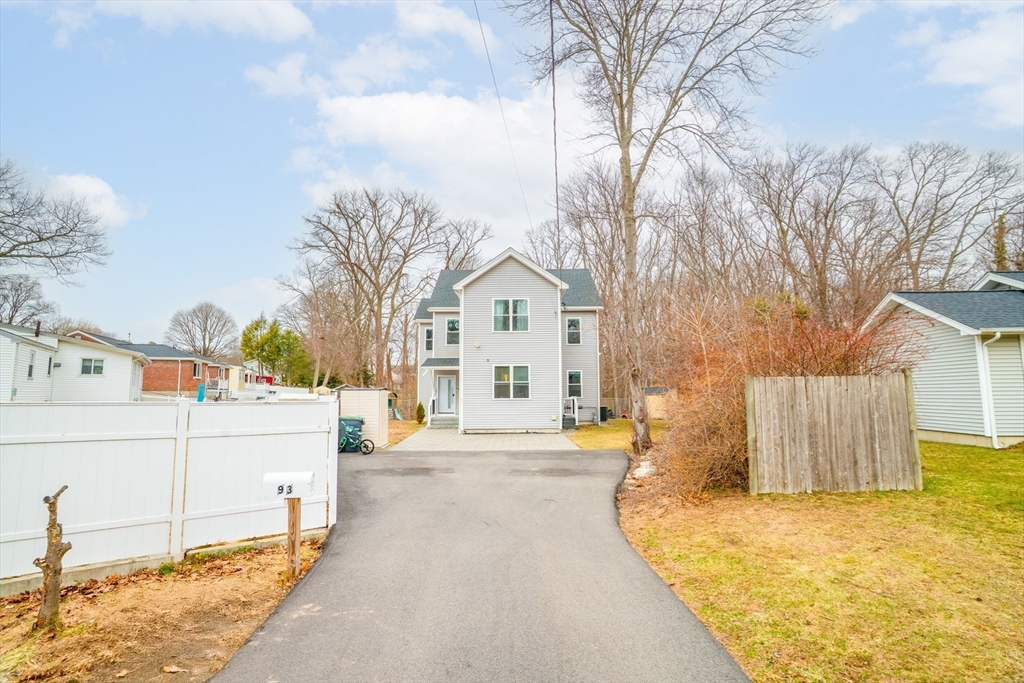 93 Alden Street Dedham, MA 02026 - Photo 34 of 41 a front view of a house with a yard