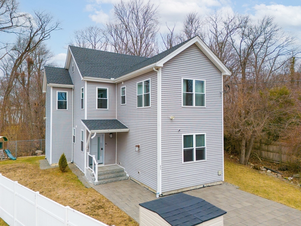 93 Alden Street Dedham, MA 02026 - Photo 36 of 41 a front view of a house with garden