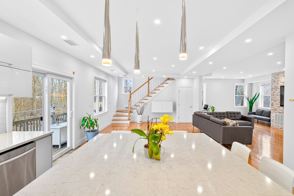 93 Alden Street Dedham, MA 02026 - Photo 4 of 41 a large kitchen with a table and chairs