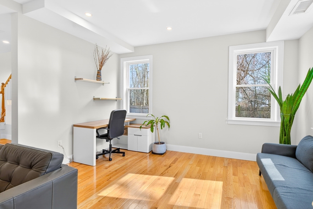 93 Alden Street Dedham, MA 02026 - Photo 10 of 41 a living room with furniture chess table and a window