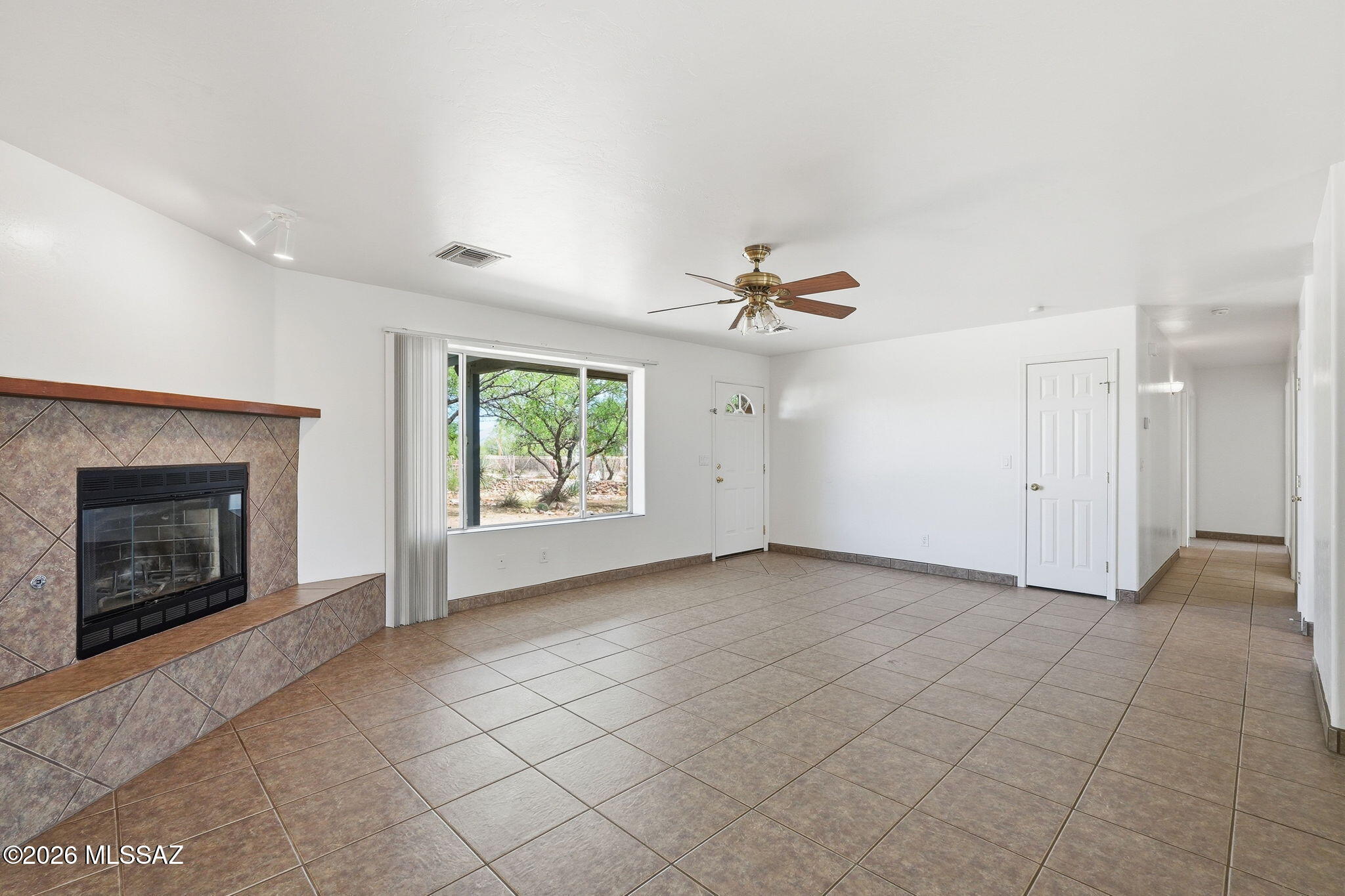 1462 Circulo Sombrero Rio Rico, AZ 85648 - Photo 13 of 50 So inviting! Huge living rm with the Fireplace and nice views out to the front porch and maure landscaped yard,
