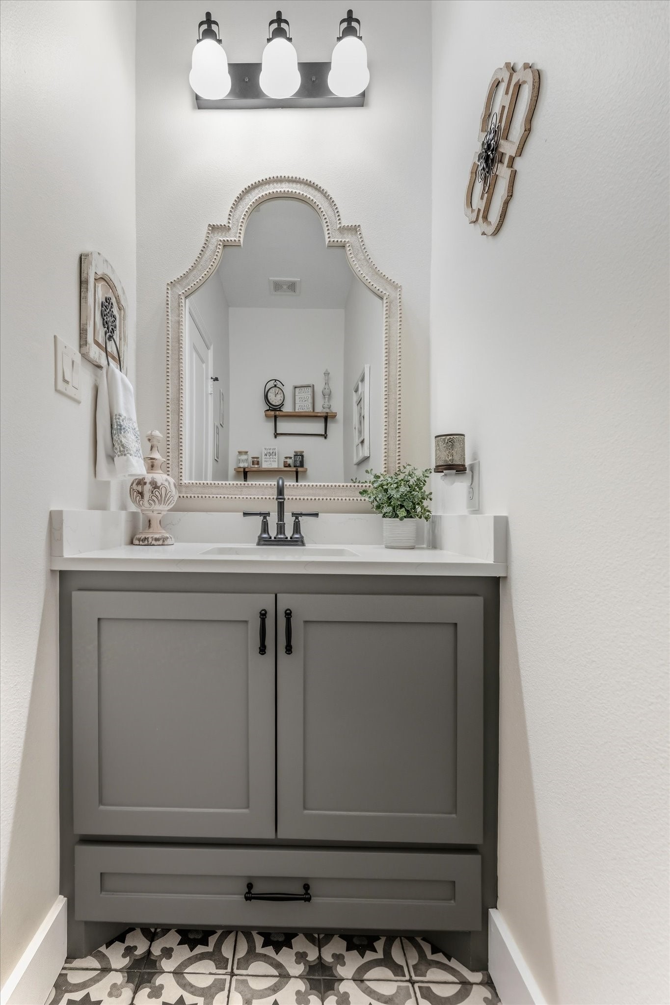 103 Fox Rindle Road Montgomery, TX 77316 - Photo 33 of 44 Stylish powder bath off the main living area features a modern vanity and designer lighting for guests.