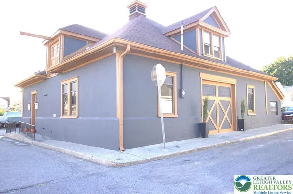 a view of a house with a barbeque