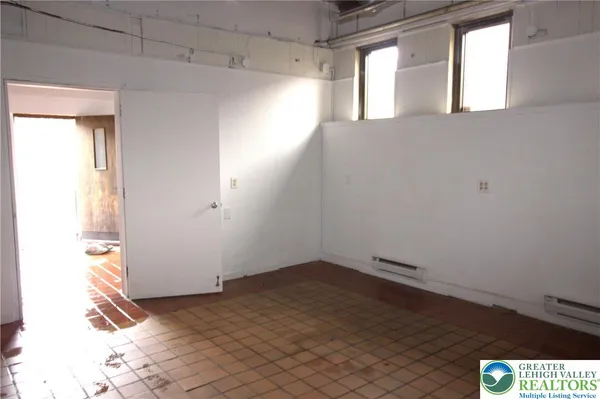an empty room with a door