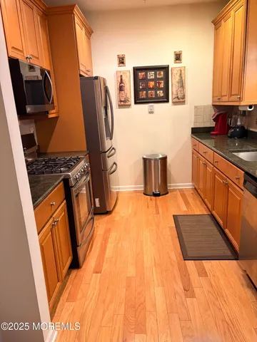 a bedroom with a bed and dresser