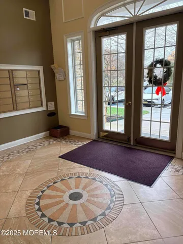 a view of a livingroom with wooden floor and ceiling fan
