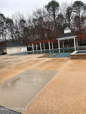 a view of a house with pool and trees