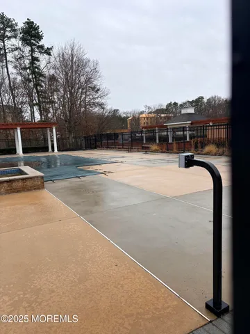 a view of a swimming pool with an outdoor space and seating area