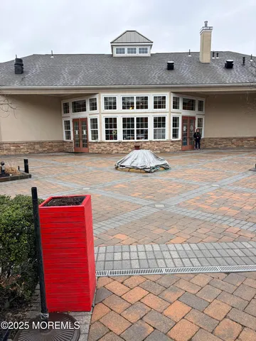 a front view of a house with a lots of windows
