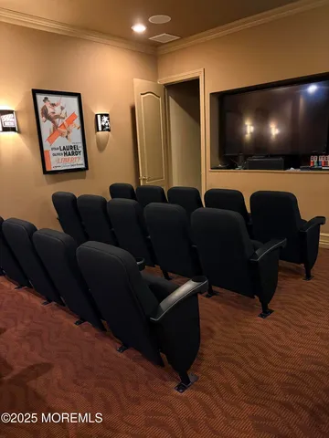 a media room with lots of chairs and wooden floor
