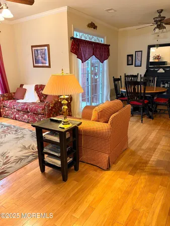 a bedroom with a bed and dresser with chair
