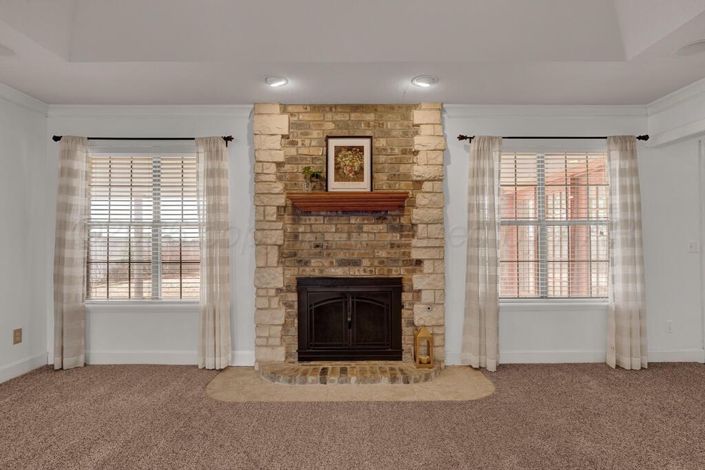 19933 Indian Spring Trail Bushland, TX 79124 - Photo 11 of 32 a living room with furniture and a fireplace