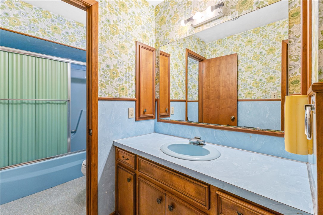 12331 Fm 2155 Somerville, TX 77879 - Photo 25 of 35 a bathroom with a sink and a large mirror