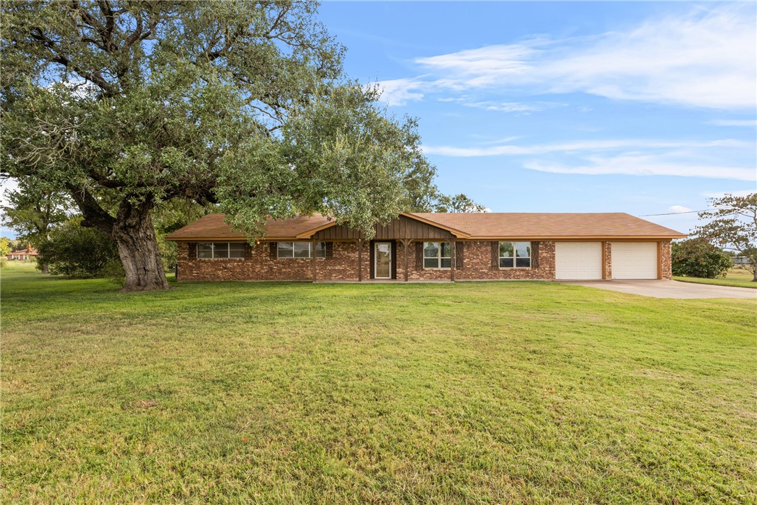 12331 Fm 2155 Somerville, TX 77879 - Photo 3 of 35 a front view of a house with a big yard