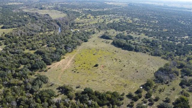 a view of a field with an ocean