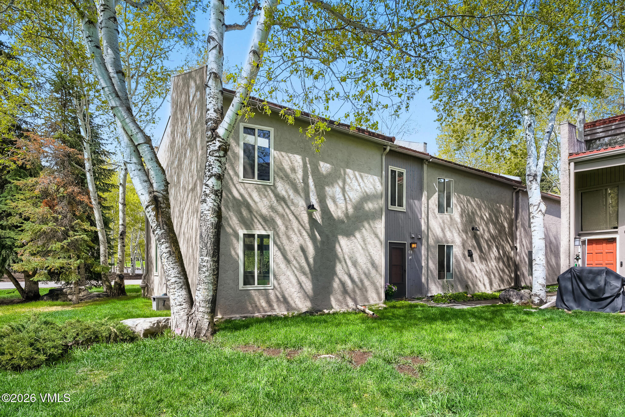 142 Eagle Drive, Unit C1 Avon, CO 81620 - Photo 18 of 20 a backyard of a house with lots of green space